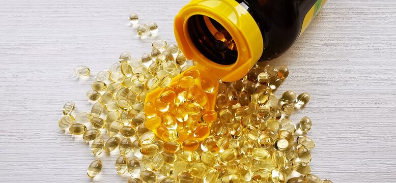 Vitamin D3 capsules. Natural OMEGA-3. A close-up photograph