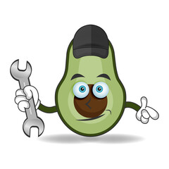 The Avocado mascot character becomes a mechanic. vector illustration