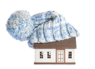 Figure of house and warm hat on white background. Concept of heating season