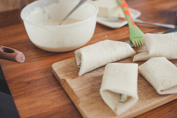 Tortillas with cheese, avocado, herbs and tomato.