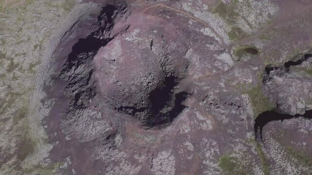 Aerial directly above dormant cone volcano in stunning natural Iceland
