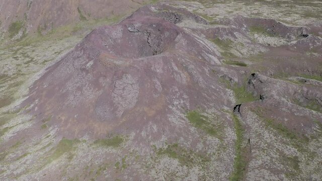 Bowl shaped volcano besides Geitafell slopes in wild Iceland, aerial