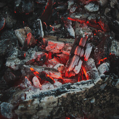 A smoldering red hot charcoal for barbecue top view