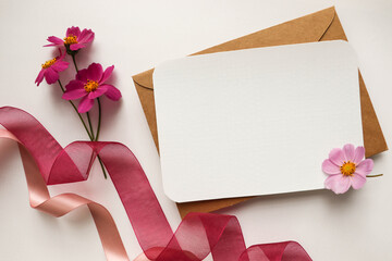 postcard layout. flowers and envelope on a white background. space for text