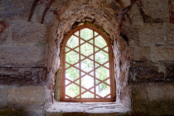 Fototapeta premium antique castle window bathed in sunlight