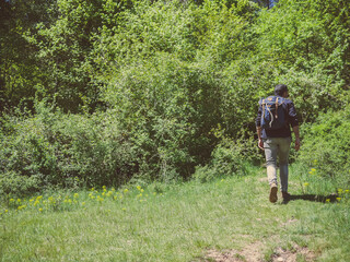 a man with a backpack on a nature excursion