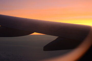 Fototapeta na wymiar Sunrise behind window plane