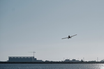 Plane sowing rice in the waterlogged field.