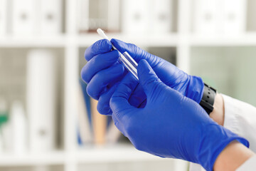 Doctor's hands preparing to make an injection
