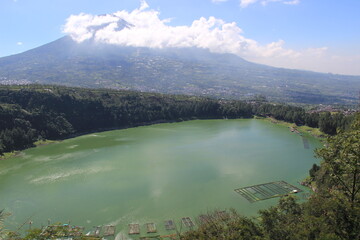 the beauty of Menjer Lake against the background of Mount Sindoro. tourist destination 'Hill of Love, Seroja Valley' Wonosobo, Central Java.