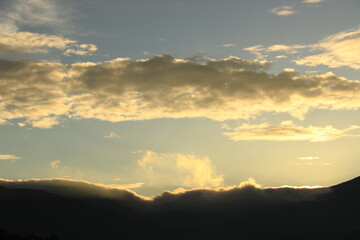 cloudy sky over Mount Sindoro. black clouds with morning sunlight