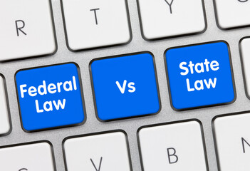 Federal law vs State law - Inscription on Blue Keyboard Key.