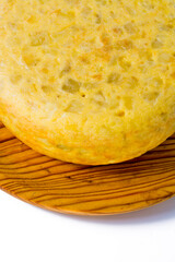 Tasty spanish omelette on a wooden tray on white background