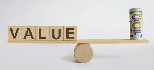 Seesaw Showing Balance Between money And word VALUE