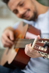 Fototapeta premium a man is practicing guitar
