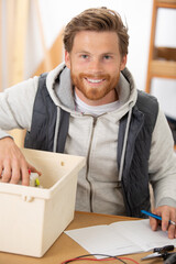 responsible man is protecting environment while sorting the waste