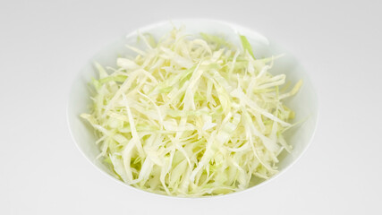 chopped white cabbage in plate close up. cabbage salad
