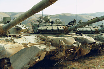 Russian battle tanks at tankodrome in mountains