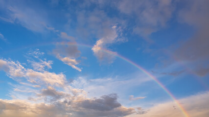 Fototapeta na wymiar Beautiful rainbow and blues sky background