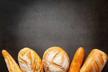 Assorted loaves of craft bread with copy space space for text