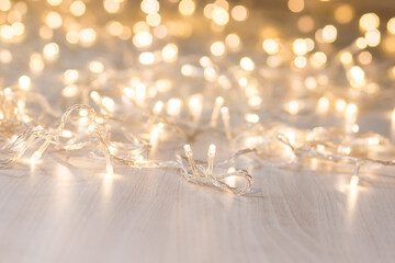 Christmas lights on light background. Decorative garland