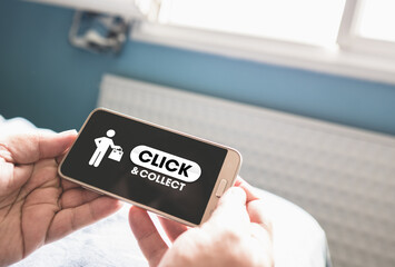 Click and collect - homme faisant un achat en ligne sur son téléphone portable pour retirer en boutique - solution pour les commerçants durant le confinement en France