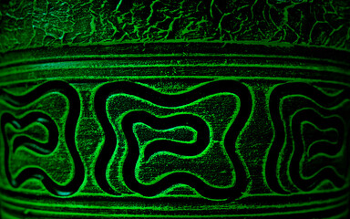 Ancient patterns and paintings on a clay pot or vessel. Abstract background.