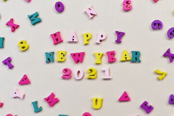 Happy new year 2021 concept with colorful wooden text flat lay