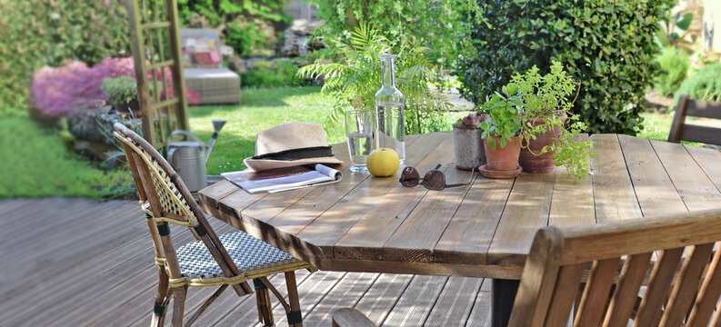 table with drink and apple in a wooden terrace in countryside house for relaxation