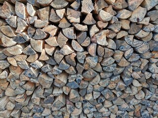 dry wood stacked in a woodpile. full-frame background