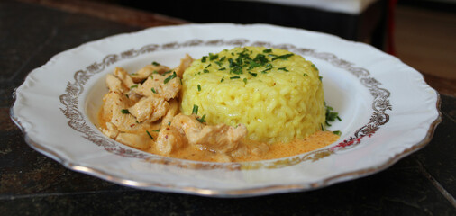 delicious curcuma rice, with chicken curry emince and pineapple