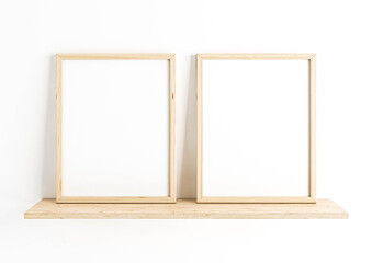 Two Vertical 8x10 Wood Frames Mockup. Double Vertical Wood Frames on a wooden shelf and white wall.