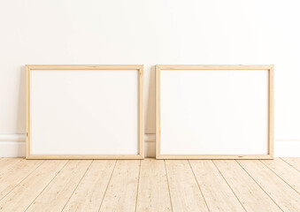 Fototapeta na wymiar Two Horizontal 8x10 Wood Frames Mockup. Double Horizontal Wood Frame on a wooden floor and white wall.