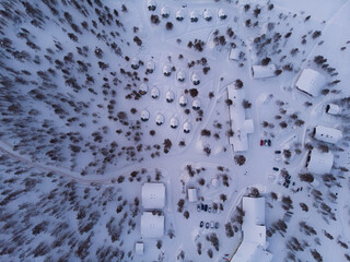 Visit Lapland Holidays. Aerial drone panorama shot of the forest covered in snow winter and the...