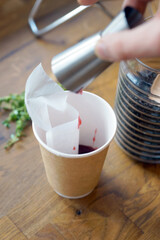 Black tea with jam in a paper cup
