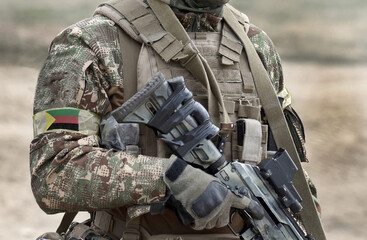 Soldier with assault rifle and flag of Azawad on military uniform. Collage.