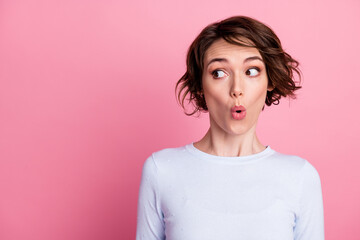 Portrait of astonished girl look copyspace open mouth wear pullover isolated over pastel color...