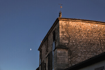 Covarrubias building with the moon at sunset, a famous village of Burgos in Spain