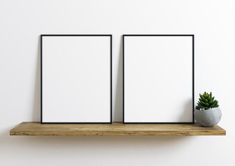Two Vertical 8x10 Black Frame mockup. Vertical Black frame on a wooden shelf with plant in a concrete vase. 