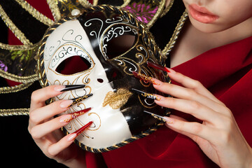 Fashionable stilettos nails design with Venetian buffoon mask