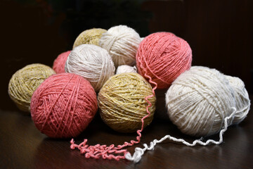 Tangles of yarn of different sizes and colors. Yarn for reuse