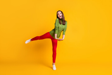 Fototapeta na wymiar Full length body size view of attractive cheerful girl jumping having fun holiday isolated bright yellow color background