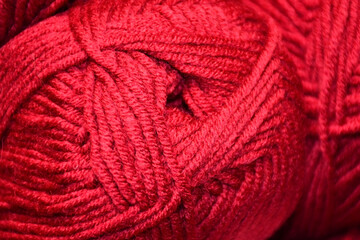 skein of red wool yarn close-up. The texture of the yarn.