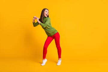 Fototapeta na wymiar Full length body size view of attractive girlish funky cheerful girl dancing party time isolated bright yellow color background
