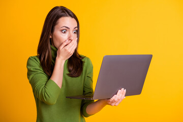 Photo of terrified lady freelancer worker hold notebook wear green sweater isolated yellow color background