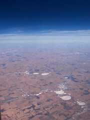 Aerial picture of white dry billabong in the middle of the red dirt of Western Australia.