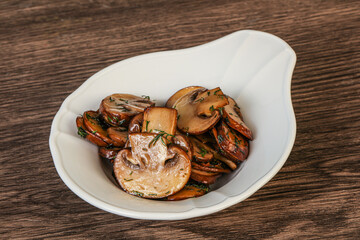 Roasted champignon with herbs and spices