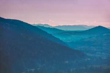 Autumn in the mountains. View of the mountains ridge at sunset. Beautiful nature landscape. Carpathian mountains. Zakarpattia Oblast, Ukraine