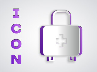 Paper cut First aid kit icon isolated on grey background. Medical box with cross. Medical equipment for emergency. Healthcare concept. Paper art style. Vector.