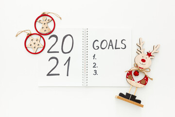 2021 New Year goals and plan with Christmas decorations on white